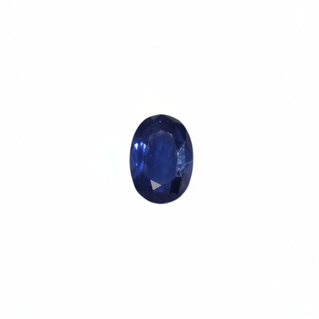 Blue gemstone in a wooden box with white interior